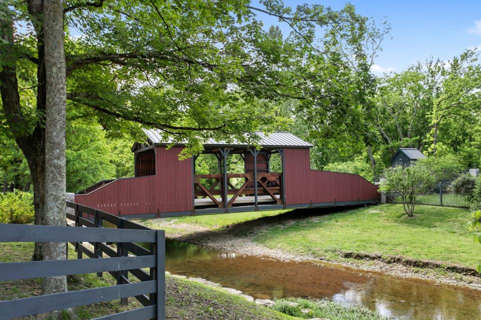 A covered bridge over one of the 383-acre property's rivers.