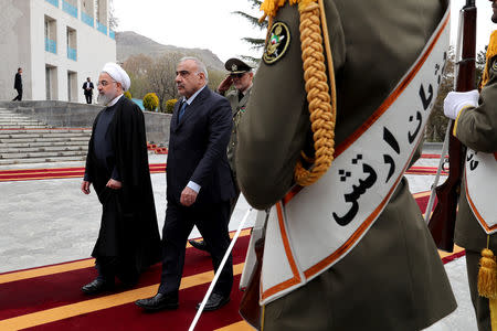 Iranian President Hassan Rouhani walks with Iraq's Prime Minister Adel Abdul Mahdi in Tehran, Iran, April 6, 2019. Official Iranian President website/Handout via REUTERS