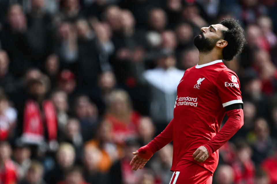 Mohamed Salah reacts after missing a chance during the English Premier League football match against Brighton and Hove Albion at Anfield.