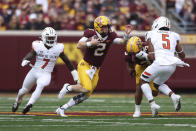 Minnesota quarterback Tanner Morgan (2) scrambles with the ball during an NCAA college football game against Bowling Green, Saturday, Sept. 25, 2021, in Minneapolis. (AP Photo/Stacy Bengs)