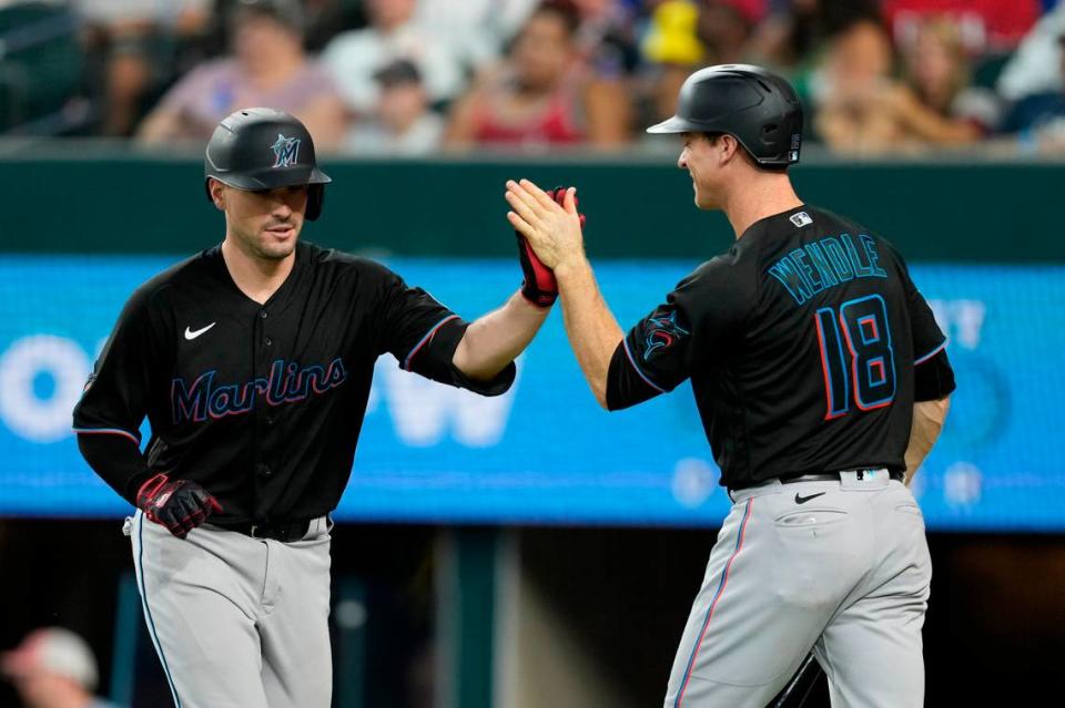 Aug 5, 2023; Arlington, Texas, USA; Miami Marlins catcher Nick Fortes (4) celebrates his home run with shortstop Joey Wendle (18) against the Texas Rangers during the sixth inning at Globe Life Field. Mandatory Credit: Jim Cowsert-USA TODAY Sports