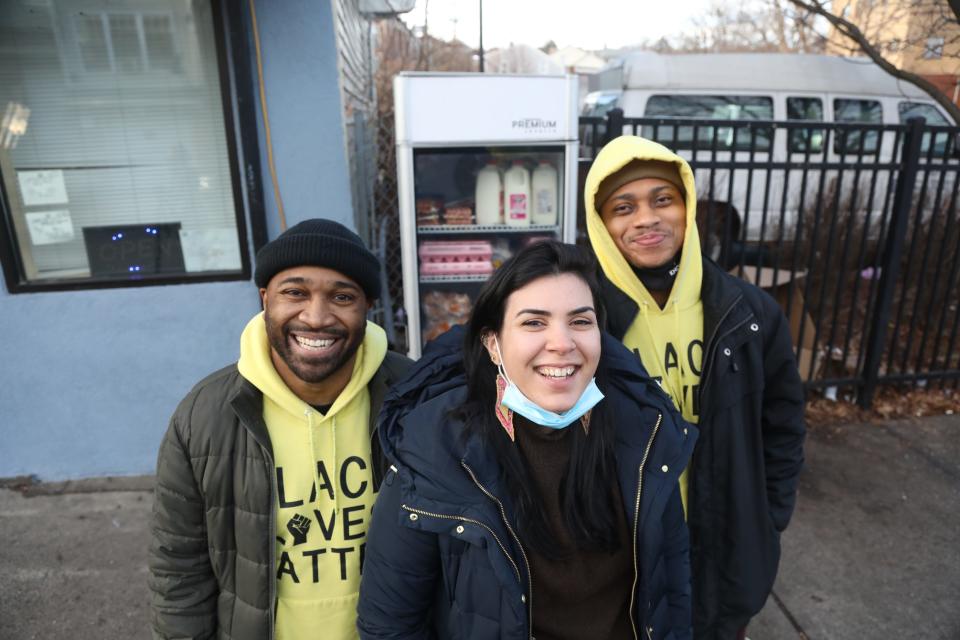 Zellie Thomas and Joseph Moore of Black Lives Matter and Abire Sabbagh of the Palestinian American Community Center in front of the community fridge at 41 North Main St. on January 20, 2022. The Silk City Community Fridge has been there since the summer, giving residents of Paterson an opportunity to get food donated by members of the community. The refrigerator is there all week and is stocked by Black Lives Matter-Paterson and the Palestinian American Community Center on Thursdays and Fridays.