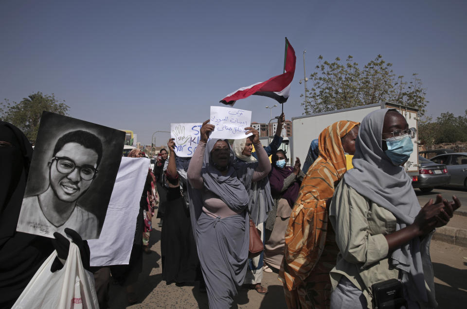 Women chant slogans against the killing of demonstrators in street protests triggered by an October military coup, in the twin city of Omdurman, about 18 miles (30 km) northwest of the capital Khartoum, Sudan, Tuesday, Jan. 11, 2022. The fall coup triggered relentless street protests and over 60 protesters have since been killed as security forces cracked down on demonstrations. (AP Photo/Marwan Ali)