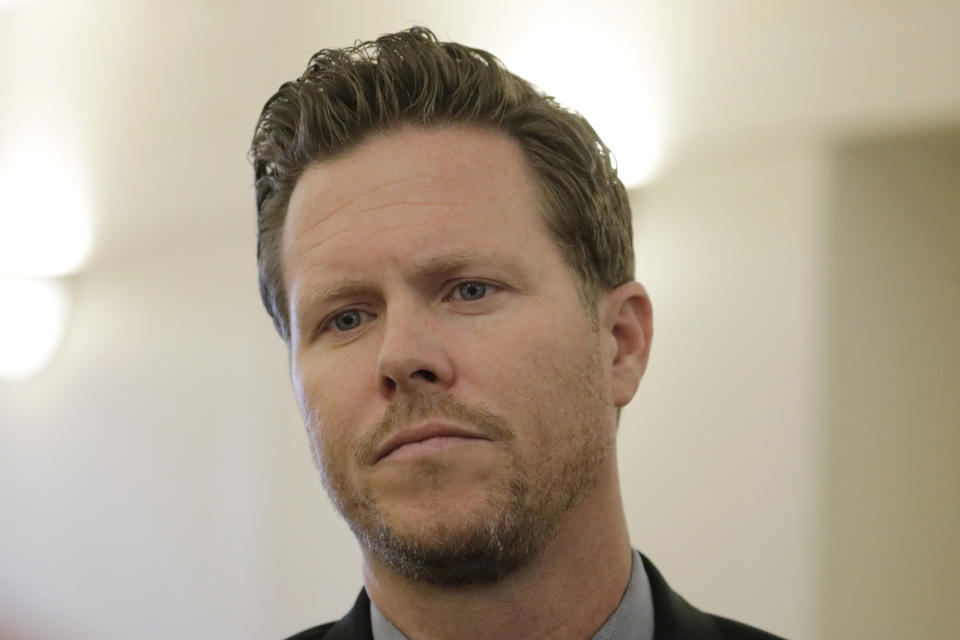 Paul Petersen, an Arizona elected official accused of running a multi-state adoption scheme, looks on following an initial court appearance on charges filed in the state Friday, Nov. 15, 2019, in Salt Lake City. Prosecutors in three states say Petersen brought pregnant women from the Marshall Islands to the United States and paid them to give up their babies for adoption. He's pleaded not guilty. (AP Photo/Rick Bowmer)