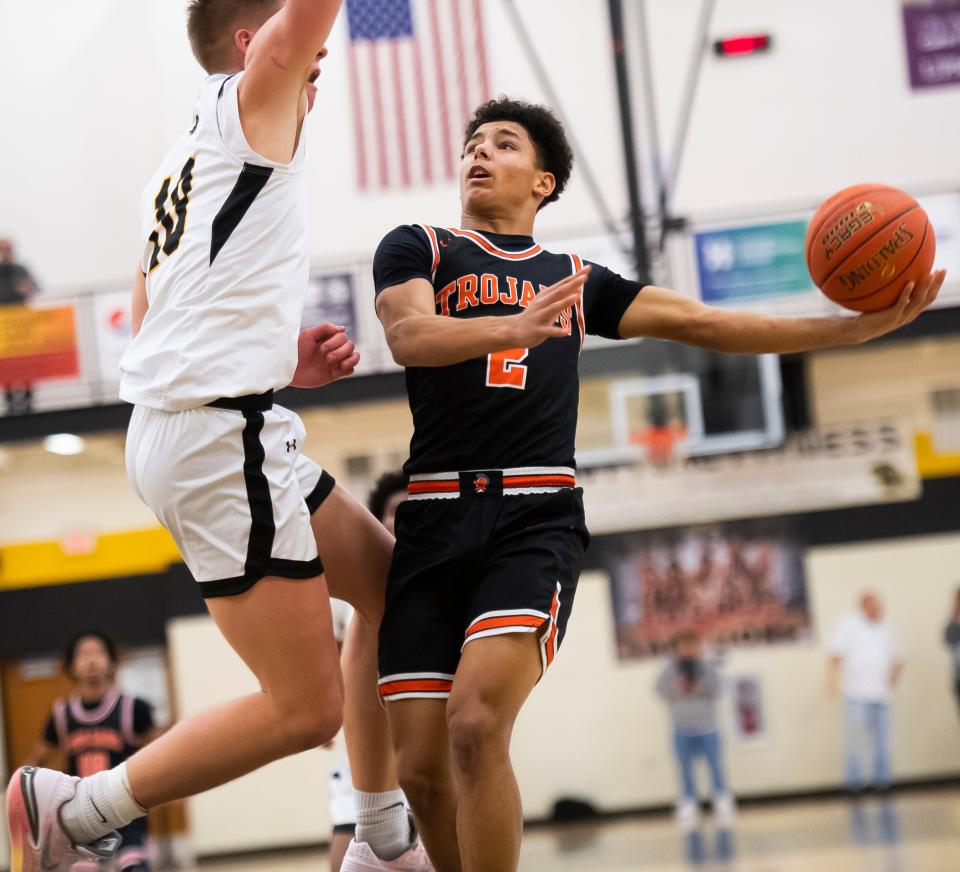 York Suburban's CJ Rissmiller goes to the basket during a YAIAA boys' basketball tournament semifinal game against Red Lion Wednesday, Feb. 14, 2024, at Red Lion Area High School. The Trojans won, 56-37.