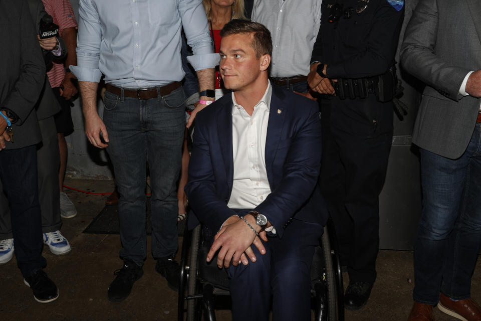 U.S. Rep. Madison Cawthorn, R-N.C., listens to a question from the media as he speaks to supporters at his primary election night watch party in Hendersonville, N.C., Tuesday, May 17, 2022. (AP Photo/Nell Redmond)