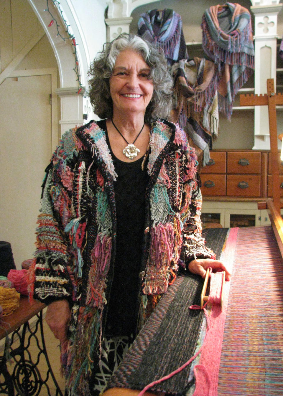 This June 7, 2012, photo shows artist Nancy Lee Kaufman in her shop in Hannibal, Mo. Kaufman moved from Santa Fe., N.M., to Hannibal after hearing other artists talk about living in the riverfront town known mostly for its favorite son, Mark Twain. (AP Photo/The Courier-Post, Mary Lou Montgomery)