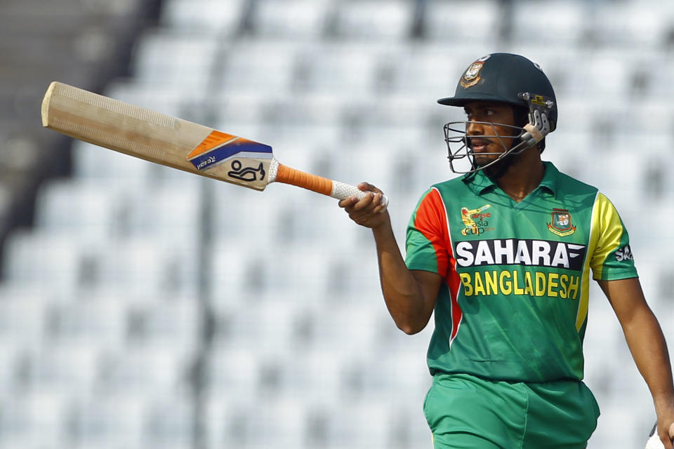 Bangladesh’s Anamul Haque acknowledges the crowed after scoring fifty runs during the Asia Cup one-day international cricket tournament against Pakistan in Dhaka, Bangladesh, Tuesday, March 4, 2014. (AP Photo/A.M. Ahad)