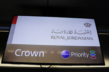 A screen showing where travelers check in for Royal Jordanian airline stands at JFK International Airport in New York, U.S., March 21, 2017. REUTERS/Lucas Jackson
