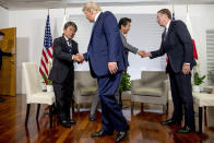 U.S President Donald Trump shakes hands with Japanese Economy Minister Toshimitsu Motegi, left, and Japanese Prime Minister Shinzo Abe, second from right, shake hands with U.S. Trade Representative Robert Lighthizer, following a news conference at the G-7 summit in Biarritz, France, Sunday, Aug. 25, 2019, where they announced that the U.S. and Japan have agreed in principle on a new trade agreement. (AP Photo/Andrew Harnik)
