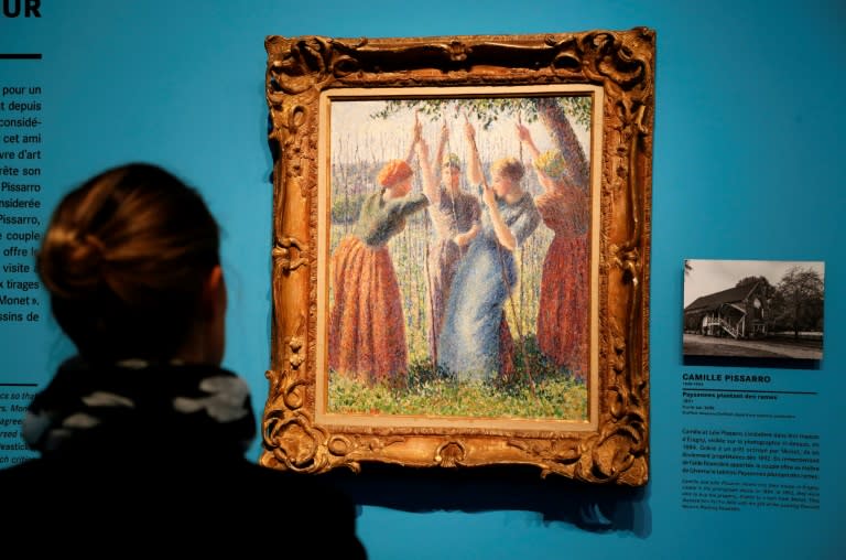 Claude Monet was a "determined" collector who sought what he wanted with a passion, including this painting of "Peasant Women Planting Stakes" (1891) by Danish-French painter Camille Pissarro