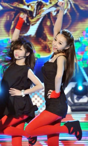 Chinese native Qi Ji (R) performs during a new talent show "Asian Idol Group Competition," in Taipei, in May. Growing numbers of young Chinese performers are eschewing the entertainment scene at home and instead coming to Taiwan in the hope of getting a big break. But can an Asian star break out beyond regional success?