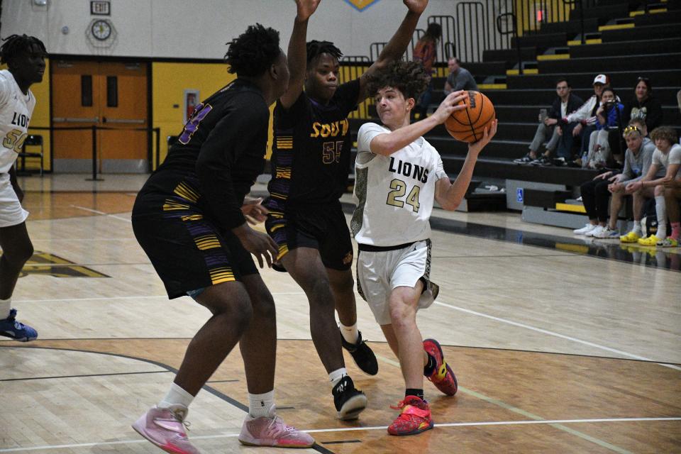 Olympic Heights' Jake Harbatkin (24) against South Plantation during the South County Martin Luther King Classic on Monday, Jan. 16, 2023.