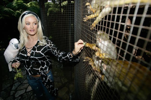 Hugh Hefner’s former girlfriend, Holly Madison, gives a tour of the Playboy mansion’s private zoo in 2006.