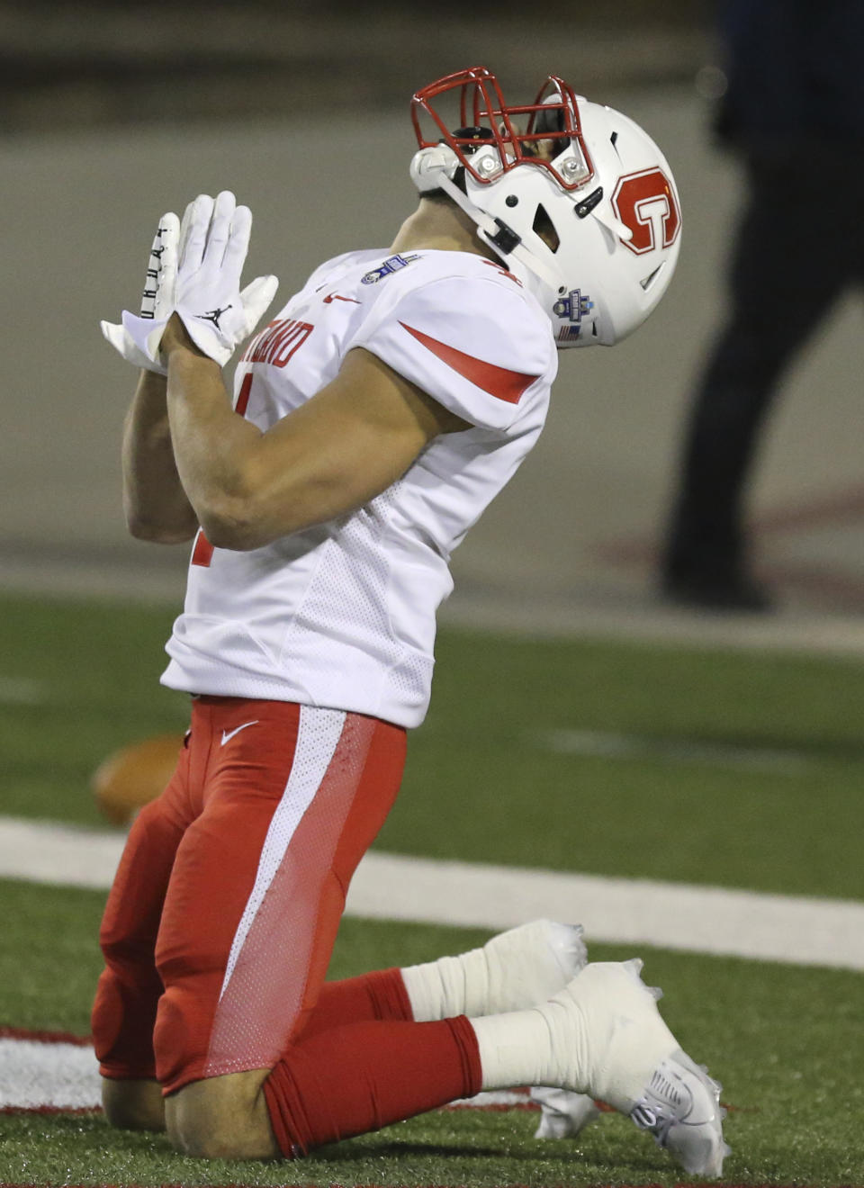 Cortland's JJ Laap (4) celebrates a touchdown against North Centra lduring the second half of the Amos Alonzo Stagg Bowl NCAA Division III championship football game in Salem, Va., Friday Dec. 15, 2023. (Matt Gentry/The Roanoke Times via AP)