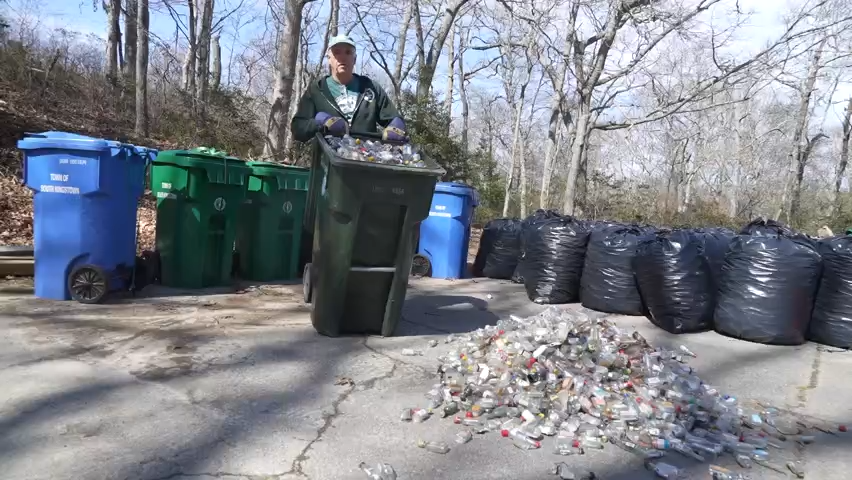 Bill McCusker, president of the South Kingstown-based Friends of the Saugatucket, dumps a load of nip bottles collected during the Great Nip Pickup Challenge earlier this year. The small plastic bottles pose an environmental threat, both as ground litter and in the state's rivers and Narragansett Bay.