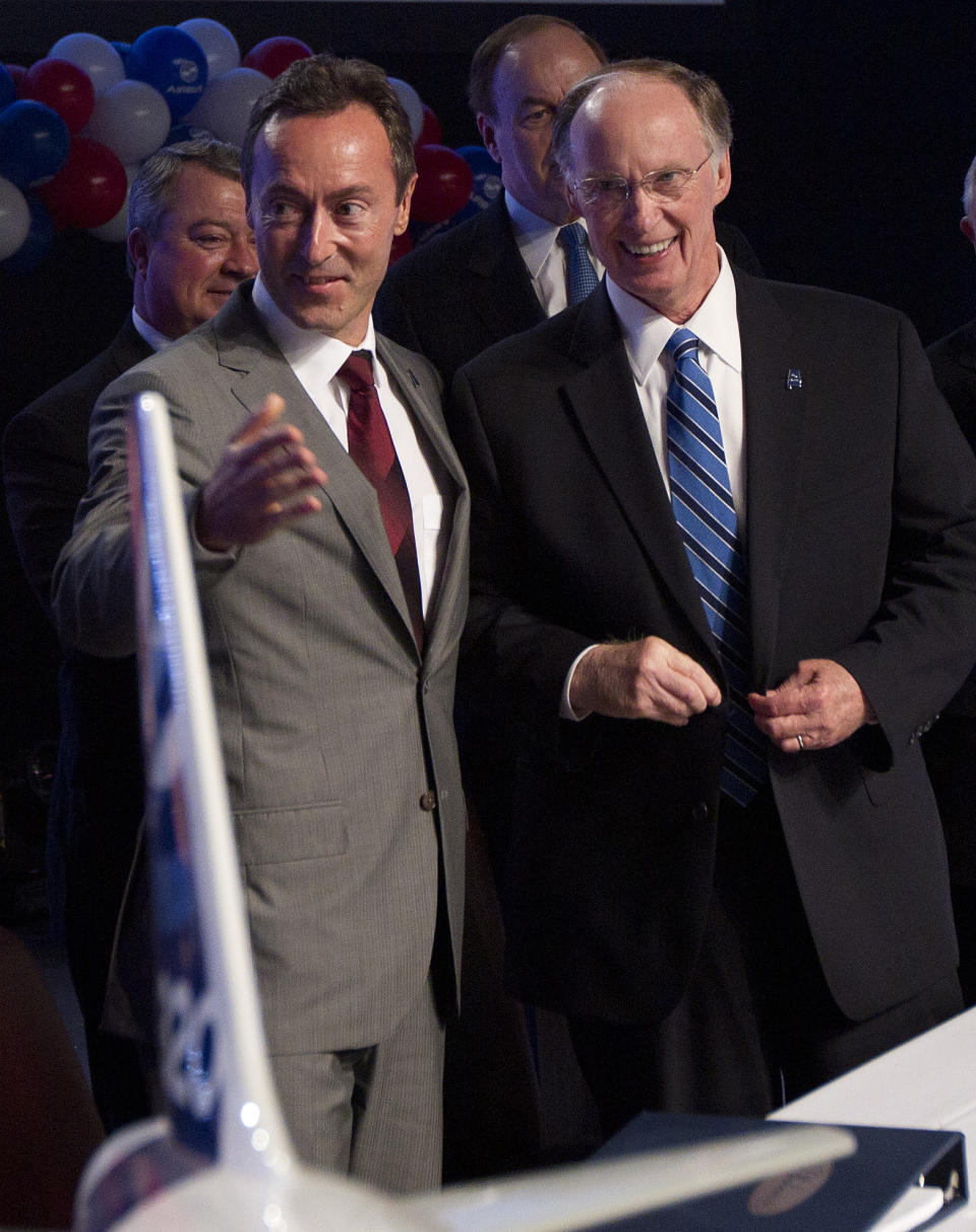 Alabama Gov. Robert Bentley, right, and Airbus President & CEO Fabrice Bregier celebrate the announcement that Airbus will establish its first assembly plant in the United States in Mobile, Ala., Monday, July 2, 2012. The French-based company said the Alabama plant is expected to cost $600 million to build and will employ 1,000 people when it reaches full production, likely to be four planes a month by 2017. (AP Photo/Dave Martin)