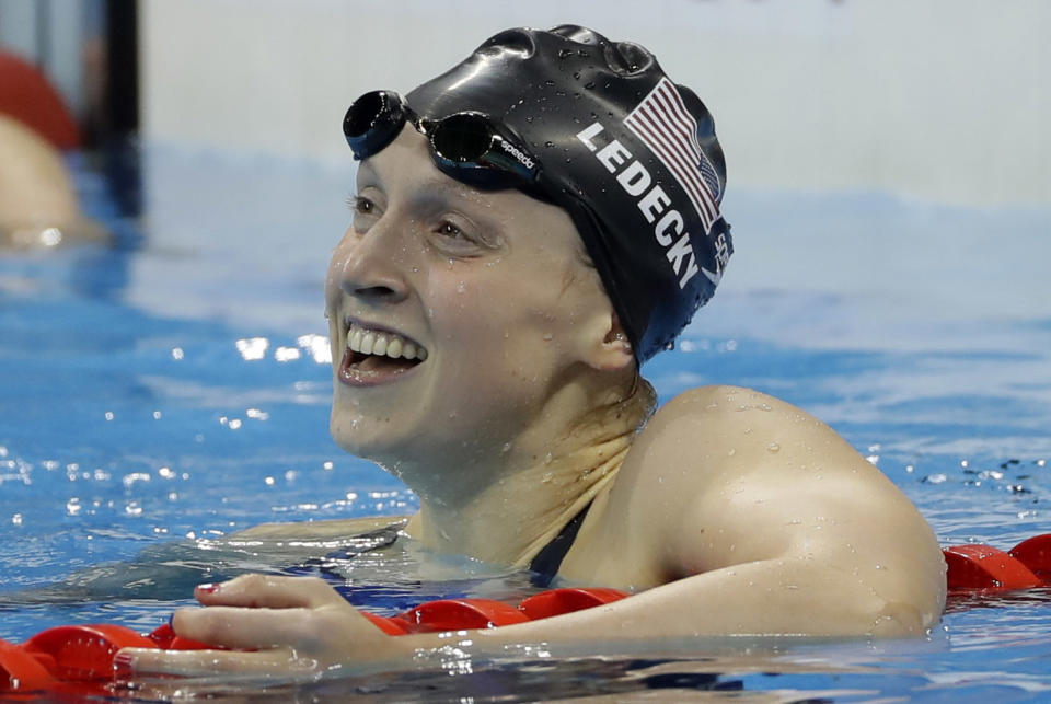 Katie Ledecky celebrates winning the gold medal in the women's 200 freestyle. (AP)