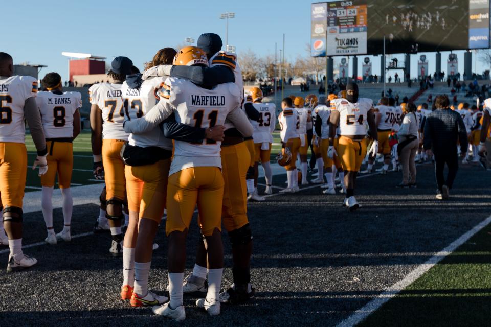UTEP players hug in the final minutes of the New Mexico Bowl in Albuquerque, NM on Saturday, Dec. 18, 2021.