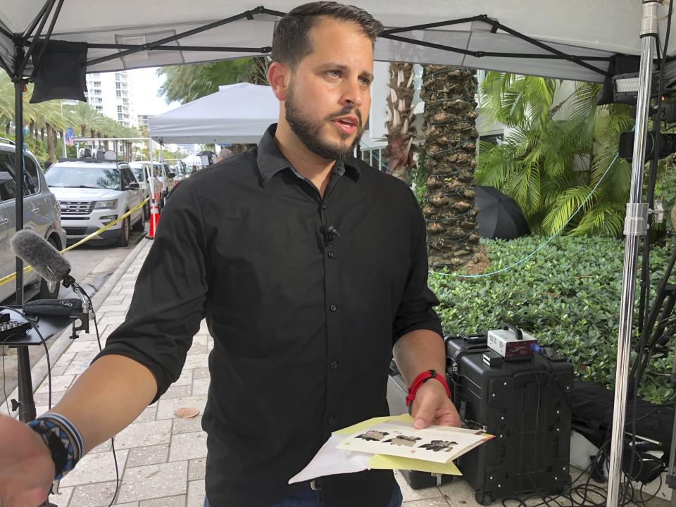 Mike Noriega speaks about a birthday card, Saturday, June 26, 2021, in Surfside, Fla., relatives sent to his grandmother, Hilda Noriega, two weeks ago for her 92nd birthday. Hilda Noriega lives on the sixth floor of the Miami building that collapsed. (AP Photo/Joshua Goodman)