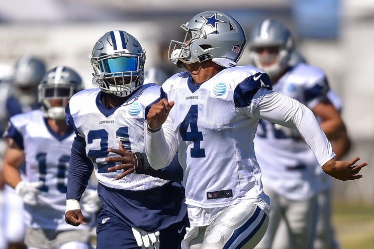 Dak Prescott and Ezekiel Elliott will try to lead Dallas to a second straight NFC East title. (AP)