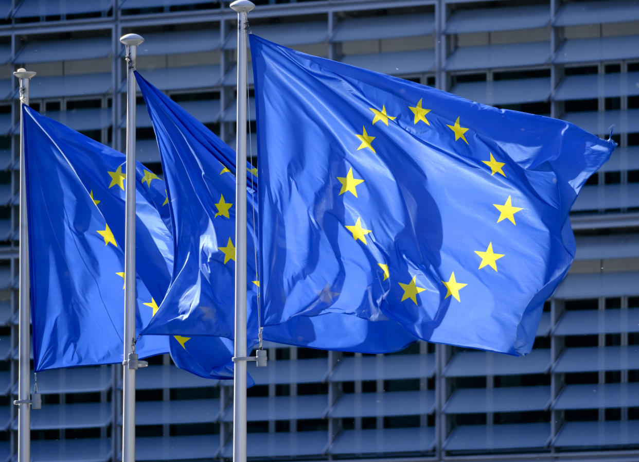 BRUSSELS, BELGIUM - MAY 19: The EU flags are seen in front of the Berlaymont, the EU Commission headquarter on May 19, 2020, in Brussels, Belgium. The authorship of the flag is due to a suggestion by the Belgian Paul Michel Gabriel Lévy, Director of Information and Press at the Council of Europe or, according to other sources, to Léon Marchal Secretary General since September 21, 1953 The actual drawing of the flag model is most probably attributable to Arsène Heitzb, mail service agent at the Council of Europe and painter, who had taken an interest in the question and had proposed from 1952 in 1955 many versions based on circles of stars on a blue background. (Photo by Thierry Monasse/Getty Images)