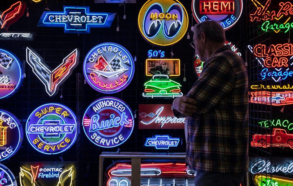 Bob Weir looks at the neon signs displayed inside Huntington Place for the 70th Annual Meguiar's Detroit Autorama car show in Detroit on Friday, Feb. 24, 2023. 