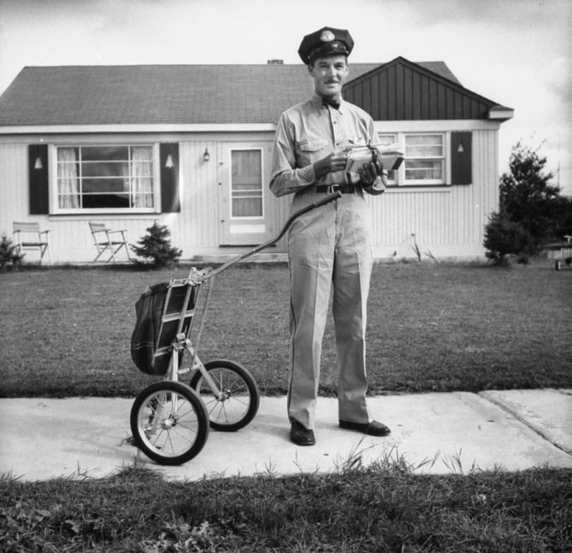 Mail carrier Clifford Bodine, Michigan, 1955. (Wallace Kirkland—Time & Life Pictures/Getty Images) <br> <br> <a href="http://life.time.com/history/the-postal-service-classic-photos/#1" rel="nofollow noopener" target="_blank" data-ylk="slk:Click here to see the full collection at LIFE.com;elm:context_link;itc:0;sec:content-canvas" class="link ">Click here to see the full collection at LIFE.com</a>