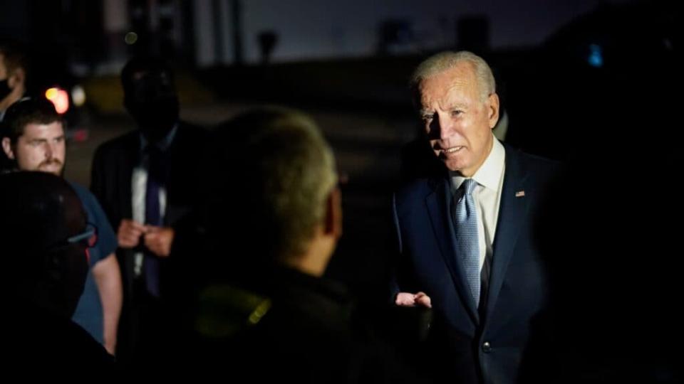 Democratic presidential nominee and former Vice President Joe Biden talks with local firefighters as he leaves a CNN town hall event in Moosic, Pennsylvania. (Photo by Drew Angerer/Getty Images)