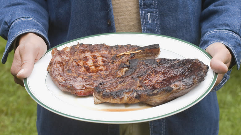 Cooked steaks carried on a plate