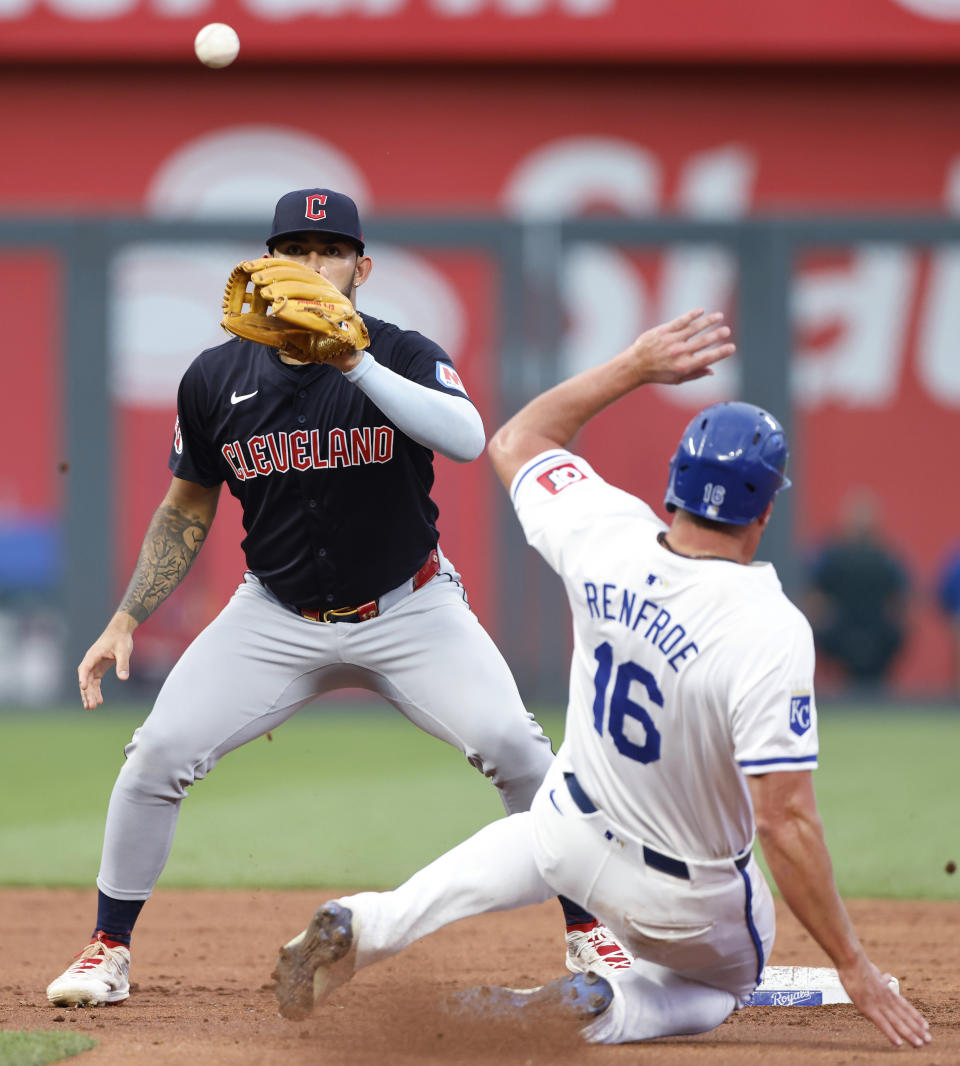 Cleveland Guardians second baseman Andrés Giménez, left, waits for the throw from first base before tagging out Kansas City Royals' Hunter Renfroe (16), after Maikel Garcia grounded out to first during the third inning of a baseball game in Kansas City, Mo., Thursday, June 27, 2024. (AP Photo/Colin E. Braley)