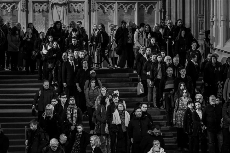 Members of the public line up to pay their respects to Queen Elizabeth II as inside Westminster Hall.