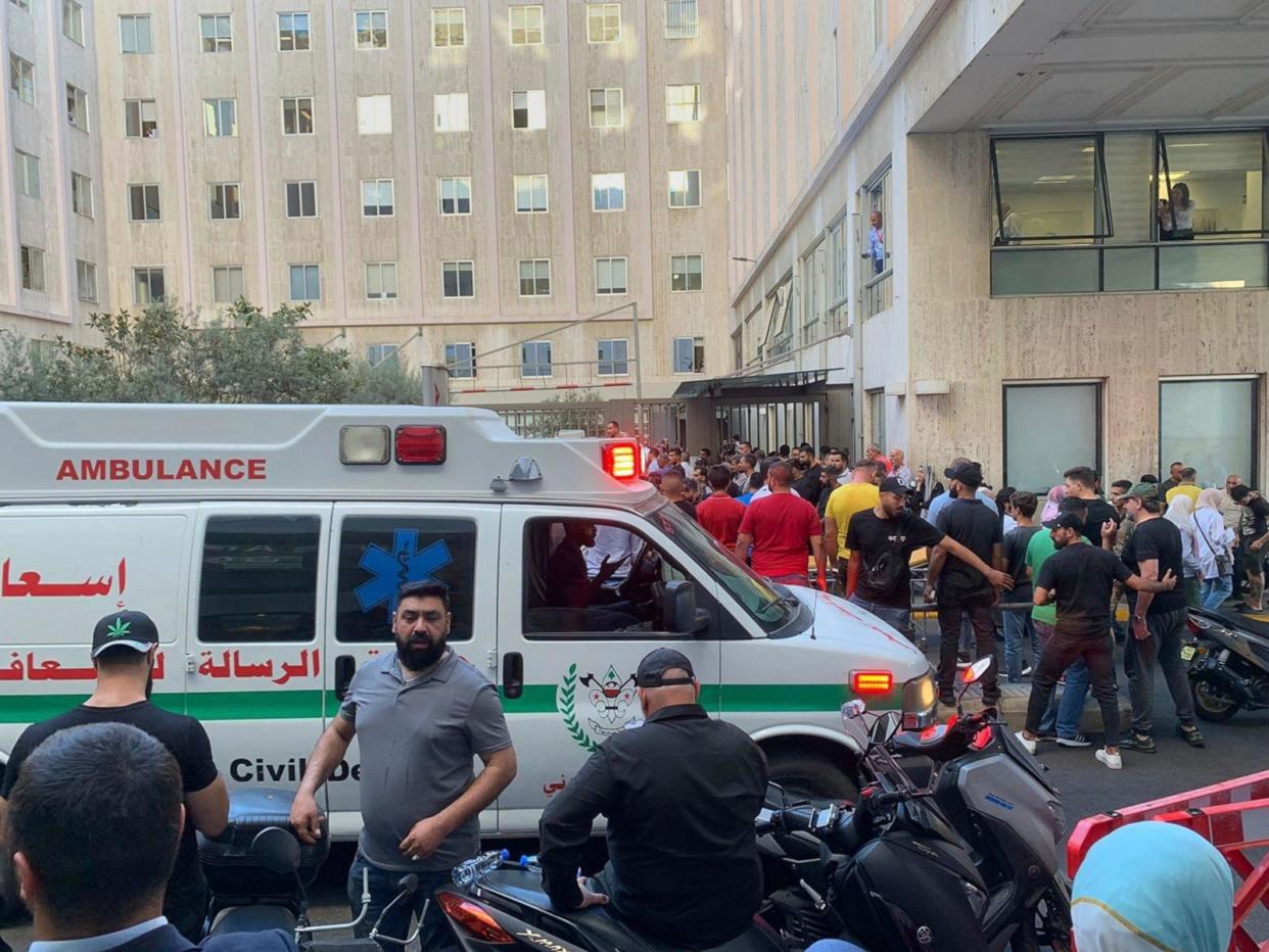 PHOTO: People gather in front of the American University Hospital after the arrival of several people injured in an explosion of handheld pagers in Beirut, Lebanon, September 17, 2024. (Bassam Masri/AP)