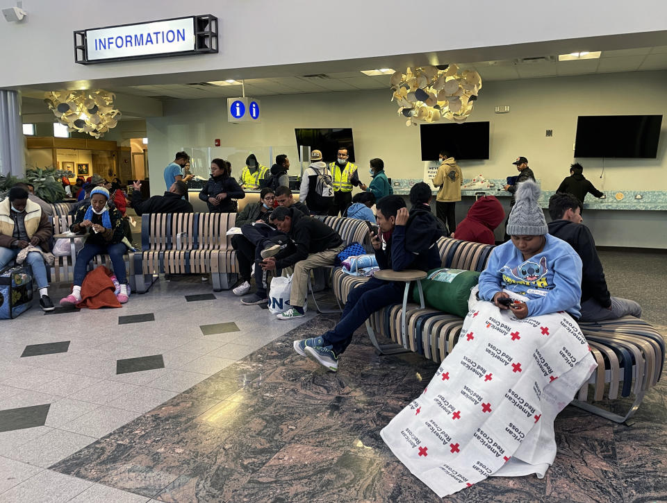 Migrants who have crossed the border and have been released by Border Patrol wait at the airport in El Paso, Texas (Erika Angulo / NBC News)