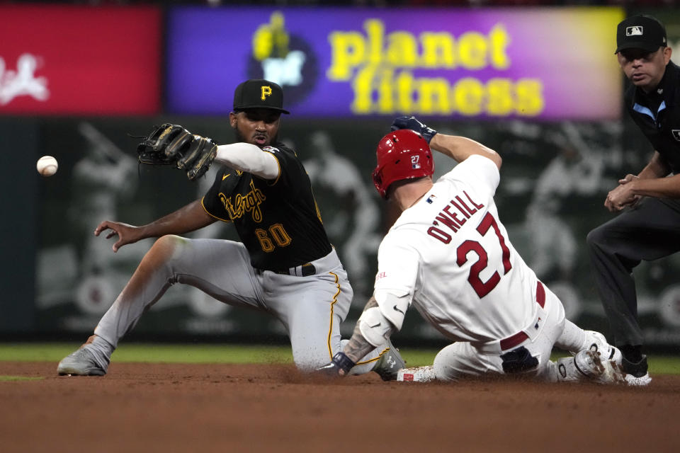 St. Louis Cardinals' Tyler O'Neill (27) is safe at second for a double as the throw gets past Pittsburgh Pirates shortstop Liover Peguero during the fourth inning of a baseball game Friday, Sept. 1, 2023, in St. Louis. (AP Photo/Jeff Roberson)
