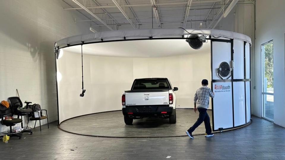 Hanna Cars of Bradenton opens for business this week at 3230 14th St. W. The used-car business specializes in low mileage, late model cars. Shown above is the carousel the company uses to photograph cars in the round, allowing customers to preview cars on online. James A. Jones Jr./jajones1@bradenton.com