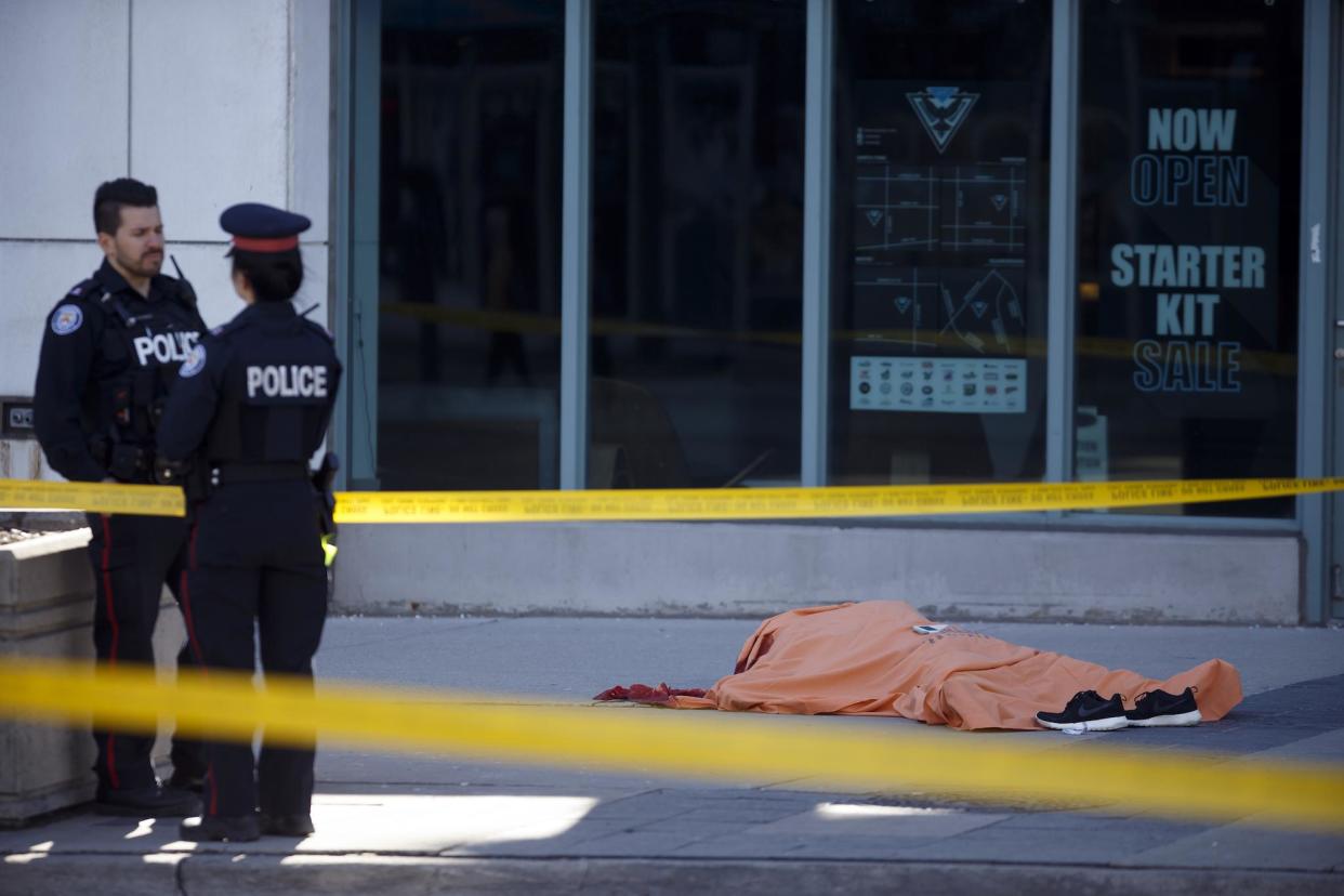 A tarp covers an unidentiified body on Yonge St. at Finch Ave. after a van plowed into pedestrians on April 23, 2018 in Toronto, Ontario, Canada: Cole Burston/Getty Images