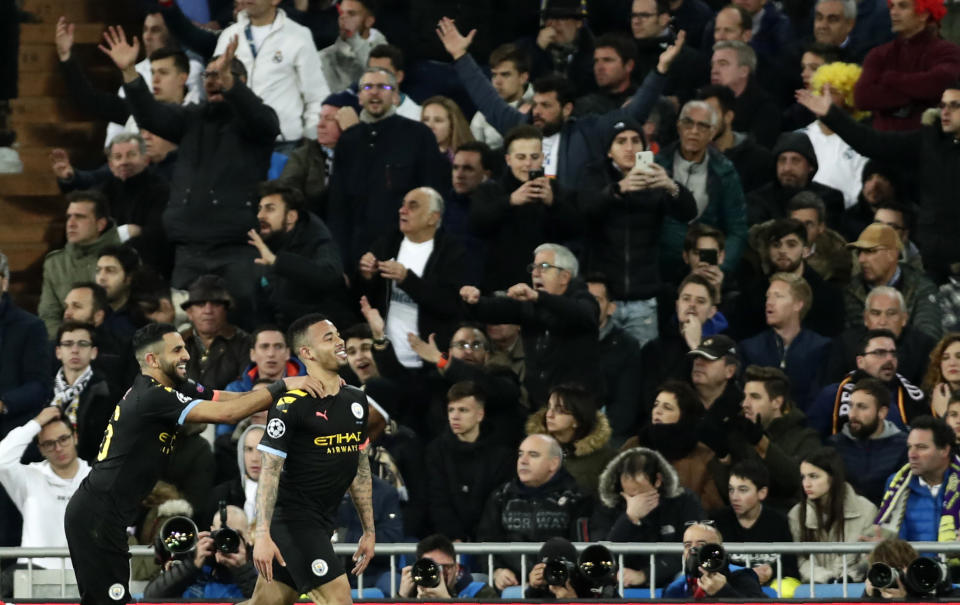 FILE - In this Wednesday, Feb. 26, 2020 file photo, Manchester City's Gabriel Jesus, right, celebrates after scoring his side's opening goal during the Champions League, round of 16, first leg soccer match between Real Madrid and Manchester City at the Santiago Bernabeu stadium in Madrid, Spain. Manchester City’s appeal against a two-year ban from European soccer will be heard over three days in June. The Court of Arbitration for Sport says it has set aside June 8-10 for the case. It is unclear if a hearing will be held in person at the court or by video link. No timetable was set for a verdict but a ruling is needed before English teams enter next season’s Champions League draw. Man City was banned by UEFA in February for “serious breaches” of financial monitoring rules and failing to cooperate with investigators. (AP Photo/Manu Fernandez, File)