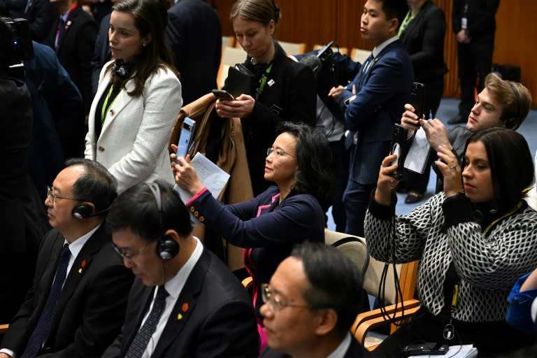 Australian journalist Cheng Lei (C) attends a signing ceremony by China's Premier Li Qiang and Australia's Prime Minister Anthony Albanese (LUKAS COCH)