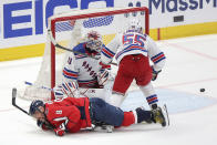 New York Rangers defenseman Ryan Lindgren (55) checks Washington Capitals left wing Alex Ovechkin (8) during the third period in Game 3 of an NHL hockey Stanley Cup first-round playoff series, Friday, April 26, 2024, in Washington. (AP Photo/Tom Brenner)