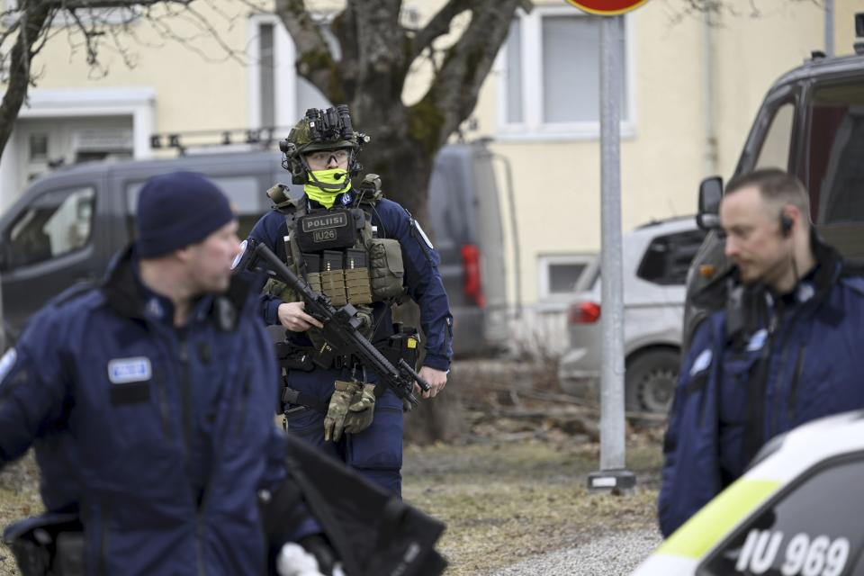 Police officers patrol outside Viertola comprehensive school, in Vantaa, Finland, Tuesday, April 2, 2024.Police in Finland say a 12-year-old student has opened fire at a secondary school in southern Finland and wounded three other students. The suspect was later arrested. Heavily armed police on Tuesday cordoned off the lower secondary school, with some 800 students, in the city of Vantaa, just outside the capital, Helsinki, after receiving a call about a shooting incident at 09:08 a.m. Police said both the suspect and the wounded were 12 years old. (Markku Ulander/Lehtikuva via AP)