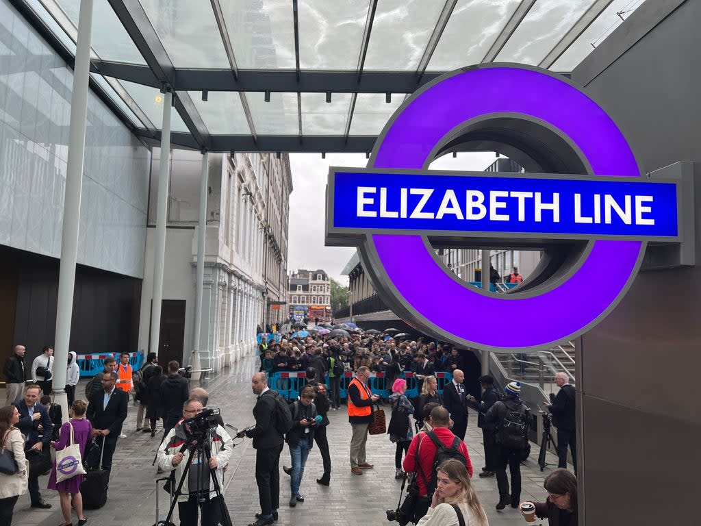 Action station: Crowds waiting at Paddington station in London for the first Crossrail passenger trains beneath the streets of London (Simon Calder)