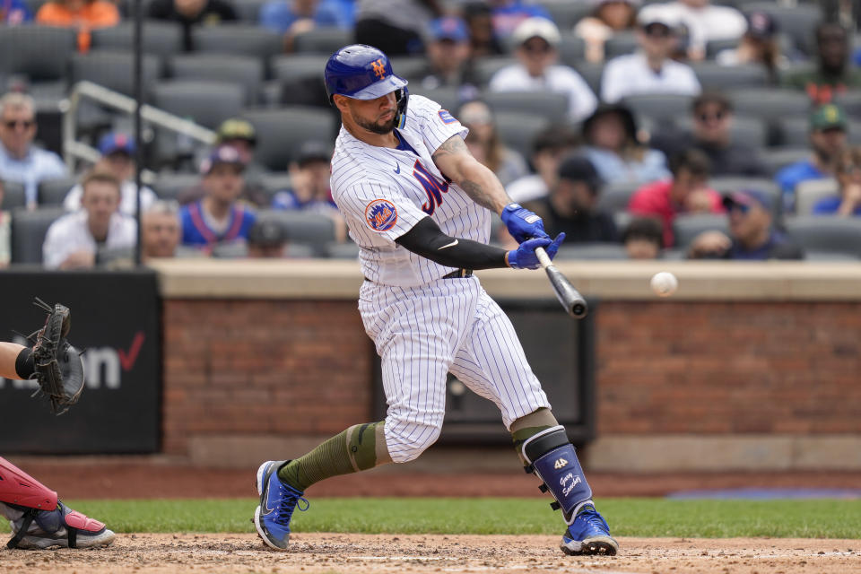 New York Mets' Gary Sanchez hits a single off Cleveland Guardians starting pitcher Tanner Bibee (61) in the fourth inning of the opener of a split doubleheader baseball game, Sunday, May 21, 2023, in New York. (AP Photo/John Minchillo)