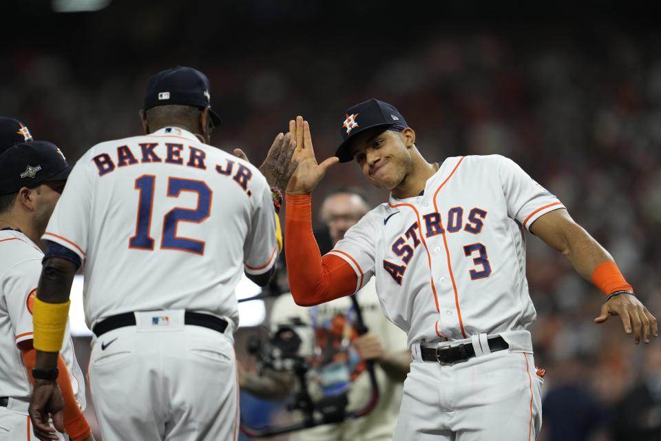 Houston Astros manager Dusty Baker high fives Jeremy Pena before Game 1 of the baseball AL Championship Series against the Texas Rangers Sunday, Oct. 15, 2023, in Houston. (AP Photo/Godofredo A. Vasquez)