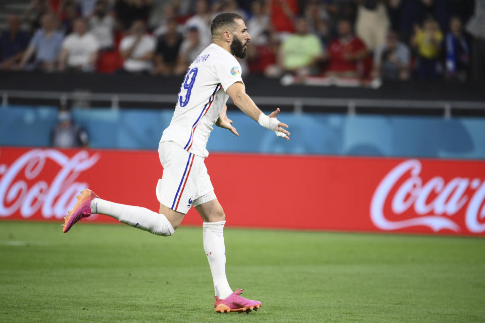 France's Karim Benzema celebrates after scoring his side's first goal from the penalty spot during the Euro 2020 soccer championship group F match between Portugal and France at the Puskas Arena in Budapest, Wednesday, June 23, 2021. (Franck Fife, Pool photo via AP)