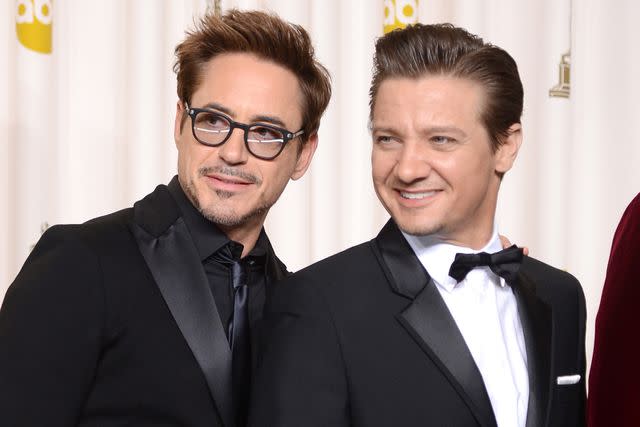 <p>Jason Merritt/Getty</p> Robert Downey Jr. and Jeremy Renner in 2013