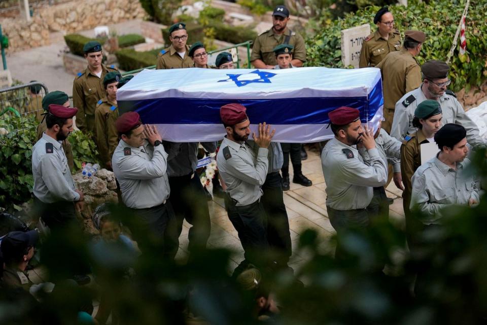 PHOTO: Israeli soldiers carry the flag-covered coffin of Maj. Tal Cohen during his funeral at the Givat Shaul cemetery in Jerusalem on Oct. 10, 2023. (Francisco Seco/AP)