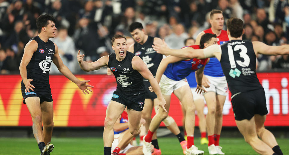 Seen here, Carlton players celebrate their thrilling win over Melbourne in the AFL.