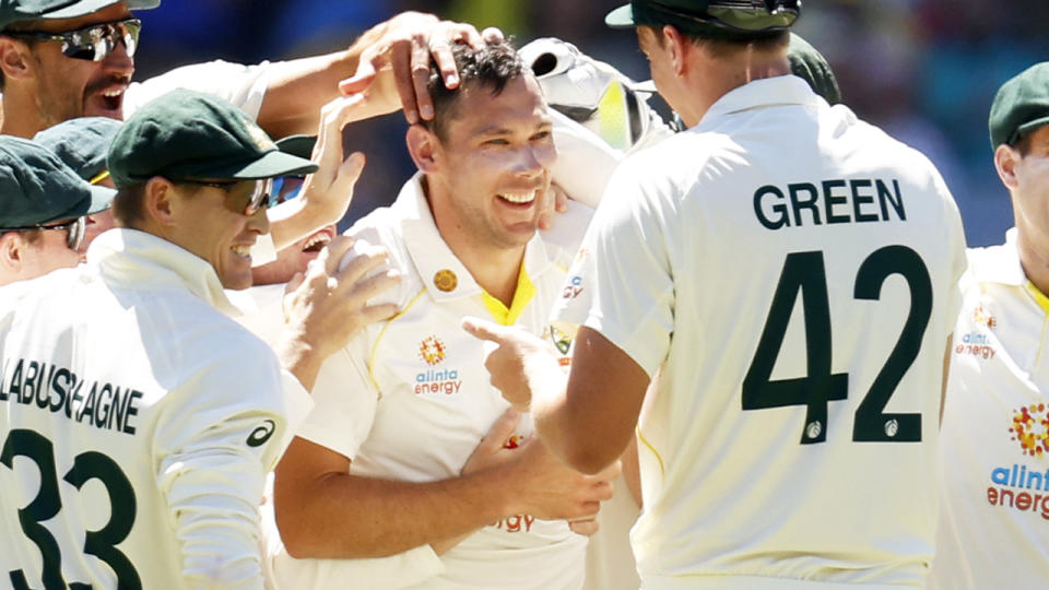 Scott Boland, pictured here celebrating with teammates after his sixth wicket of the second innings.