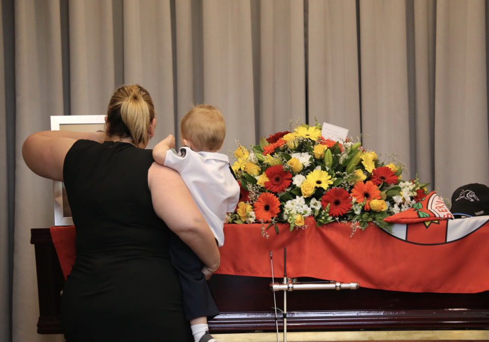 Mr Keaton's fiancee Jess Hayes and Harvey are seen standing next to the 32-year-old's coffin. Source: RFS